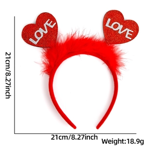 Detail of red Valentine heart headband with fluffy feathers and silver LOVE text