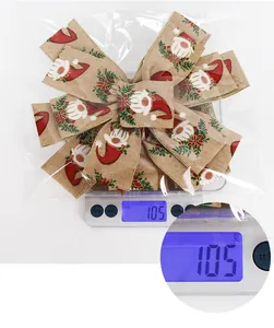 Christmas burlap bow with festive gnome prints showing detailed texture and weight in packaging