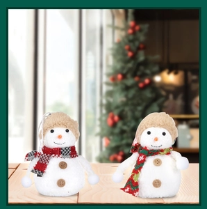 Detail of plush Christmas snowmen with plaid scarves and wooden buttons for tree decoration
