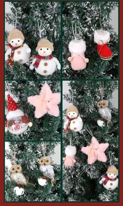 Festive plush snowman, glittering owl and star ornaments hanging on a snowy Christmas tree