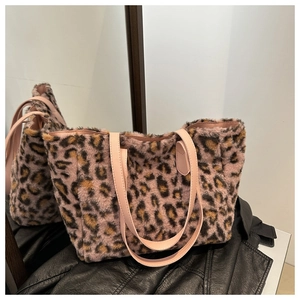 Detailed texture of pink leopard print plush tote bag with leather straps and large capacity