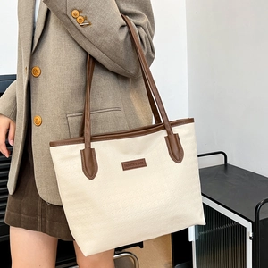 Minimalist large capacity tote bag in beige textured leather with brown shoulder straps