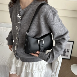 Minimalist black leather hobo shoulder bag with a stylish silver buckle strap for women