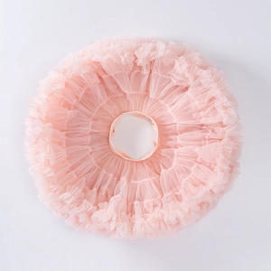 Flat lay macro of multi-layer soft pink tulle layers on girls tutu skirt