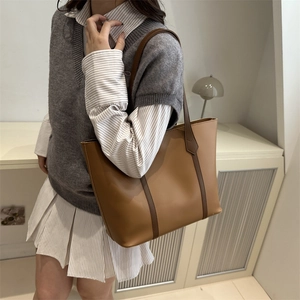Retro caramel leather tote bag with dark brown straps for daily commute or campus