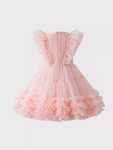 Detail of pink ruffled tulle layers and invisible back zipper on girls' princess dress