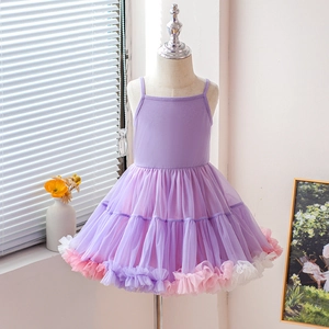 Detailed view of purple layered mesh tutu skirt with ruffled trim for girl's dress