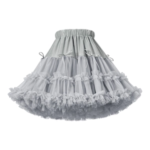 Detail of multi-layered light gray tutu skirt with fine mesh tiers and small bow accents