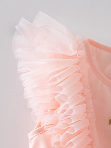 Detail of pink ruffled flutter sleeves with multi-layered soft tulle and round neckline