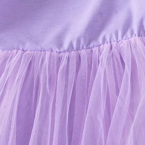 Detail of purple tutu dress showing the seam between knitted bodice and fluffy tulle skirt