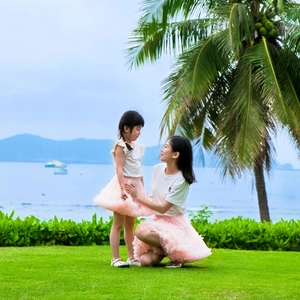 Detail of mother and daughter matching sets with white t-shirts and pink tutu tulle skirts