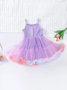 Purple girls tutu dress with colorful mesh layers and spaghetti straps in flat lay view