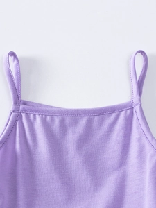 Detail of purple knitted strap dress showing fine stitching and breathable fabric texture