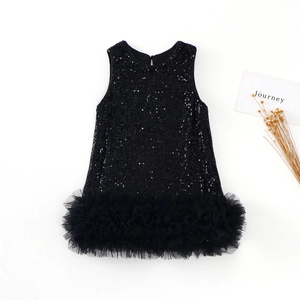 Detailed view of black sequins and fluffy tulle hem on a sleeveless girl princess dress