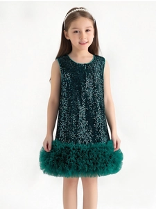 Detail of dark green sleeveless tutu dress with sparkling sequins and layered mesh skirt