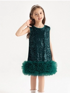 Detail of dark green sequins and pleated tulle ruffles on the elegant princess tutu dress