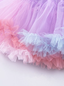 Detail shot of multi-layered pastel mesh tutu skirt showing pink and purple tulle fabric