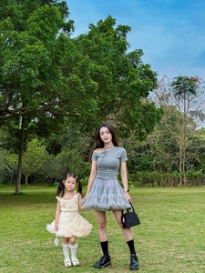 Outdoor shot of matching mother and daughter tutu skirts with pearl details and lace