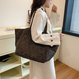 Large leopard print canvas tote bag with wide shoulder straps for women commuting