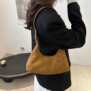Minimalist brown suede crescent shoulder bag with adjustable strap for women