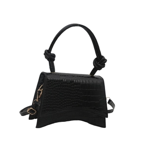 French style hourglass handbag with black crocodile texture and curved base design