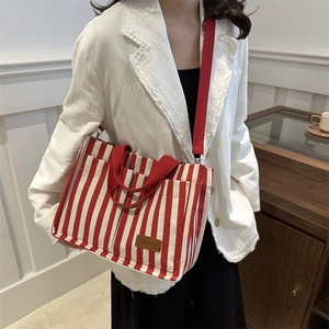 Red and white striped canvas tote bag with fashion leather tag and crossbody strap