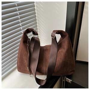 Detail of vintage brown suede tote bag with white contrast stitching and drawstring
