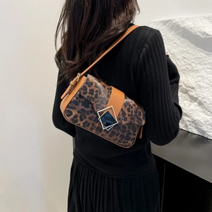 Chic leopard print shoulder bag with brown leather trim and a vintage metal clasp for women