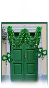 Green tinsel garland and shamrock pendant decorations for St. Patrick's Day door display