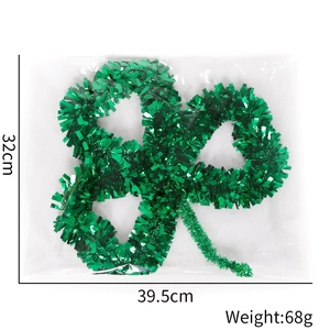 Macro detail of St. Patrick's Day green clover tinsel decoration with 39.5cm size markings