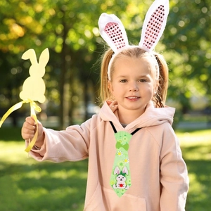 Close-up of Easter rabbit ears headband and green floral tie for children party