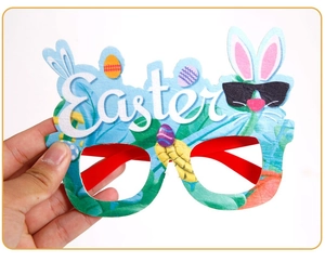 Detail of blue Easter decorative glasses with white bunny and egg pattern lettering