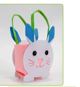 Detail of Easter felt basket with bunny ears and colorful green handle for kids