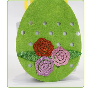 Close-up of Easter non-woven felt gift bag with glitter rose flowers and egg shape design