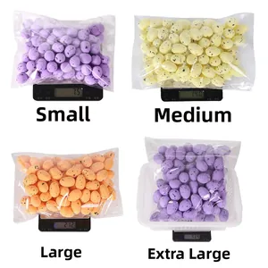 Speckled Easter foam eggs in four sizes shown on scales for weight comparison