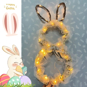 Easter bunny wreath with warm white LED lights and silver bow for holiday wall decoration