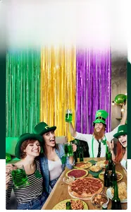 Close-up of shiny green gold and purple tinsel foil fringe curtain for party backdrops