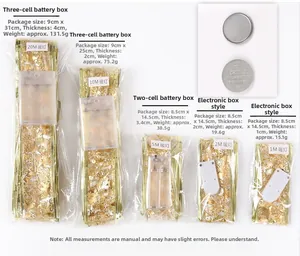 Detail of LED ribbon lights with gold glitter finish and various battery box sizes
