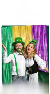 St. Patrick's Day costume set with green top hat and metallic foil fringe backdrop