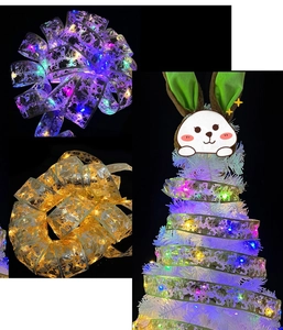 Easter LED ribbon lights featuring rabbit and egg prints on a white decorative tree