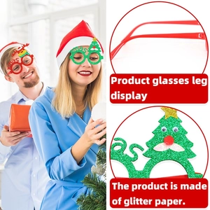 Detail of Christmas glasses showing glitter paper texture and festive reindeer horn designs