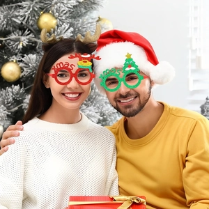 Detailed view of kids' Christmas glasses with glittery Xmas letters and reindeer icons