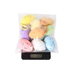 Detail of multi-colored speckled Easter egg hanging decorations in transparent packaging