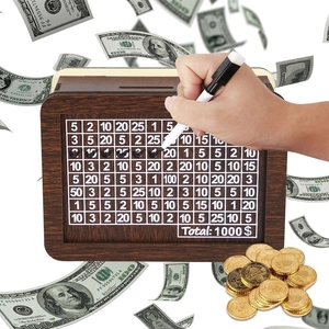 Detail of wooden money box with a 1000 dollar savings goal counter and marker pen