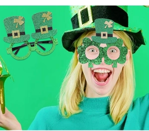 St. Patrick's Day party glasses with green glitter top hats and shamrock festive designs
