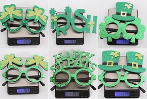 Detailed view showing weight of green shamrock and Irish party glasses props