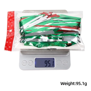 Weight measurement of 1x2.5M red green silver fringe curtain on a digital scale