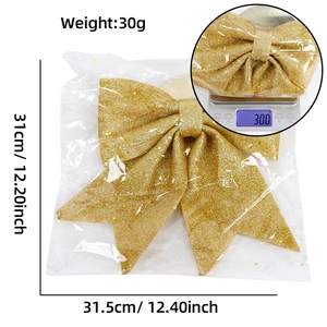 Detailansicht der großen goldenen Glitzer-Weihnachtsschleife mit 31,5 cm Breite und 31 cm Höhe