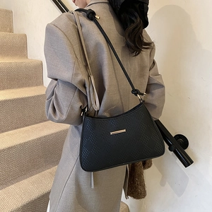 Minimalist black woven pattern underarm shoulder bag with golden metal buckle and knot strap