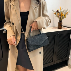 Chic black glitter crossbody bag with chain strap for 2024 trendy evening styling